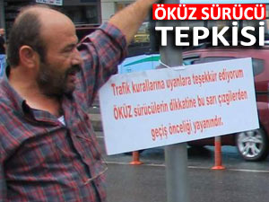 'ÖKÜZ SÜRÜCÜLERİN DİKKATİNE' levhası astı