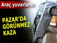 Pazar'da park halindeki araç çay bahçesine yuvarlandı