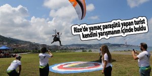 Rize'de yamaç paraşütü yapan turist kendini yarışmanın içinde buldu