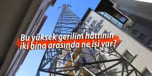 Bu yüksek gerilim hattının iki bina arasında ne işi var?