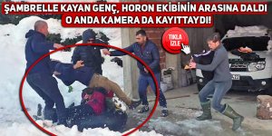 Şambrelle kayan genç, horon ekibinin arasına daldı