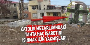 Isınmak için Katolik mezarlığındaki haç işaretini yaktılar!