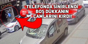 Telefonda sinirlendi, işletmenin camlarını kırdı