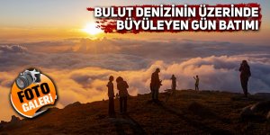 Bulut denizinin üzerinde büyüleyen gün batımı