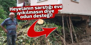 Heyelanın sarstığı eve yıkılmasın diye odun desteği!