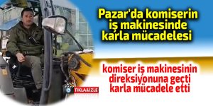 Pazar'da komiserin iş makinesinde karla mücadelesi